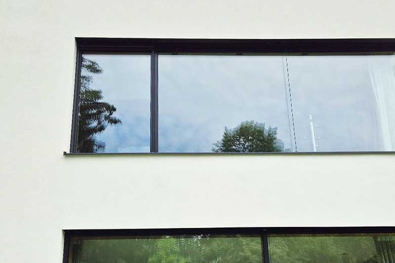 Einfamilien Hausfassade reinigen lassen in Nürtingen Ergebnis nach algenfiX Fassadenwäsche